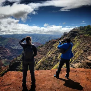 Helicopter flying over Kauai island landscape