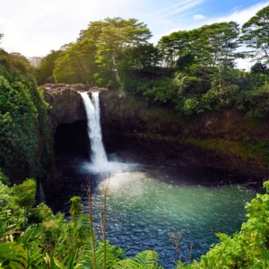 Tour group exploring volcanic landscape with guide