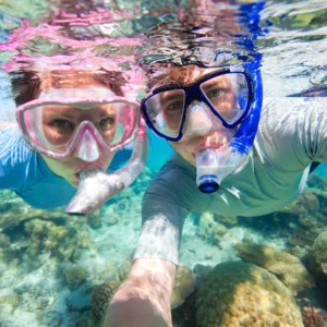 Guided snorkeling tour exploring vibrant Waikiki reef